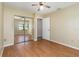 Standard bedroom features closet with mirrored doors, and hardwood floor at 1709 Winter Green Blvd, Winter Park, FL 32792