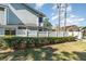 Exterior view of the home showcasing well-maintained landscaping and architecture at 1709 Winter Green Blvd, Winter Park, FL 32792