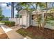 Charming front entrance with lattice work and landscaping, welcoming visitors to this lovely home at 1709 Winter Green Blvd, Winter Park, FL 32792