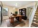 Functional home office setup with a desk, shelving, and natural light, ideal for remote work at 1709 Winter Green Blvd, Winter Park, FL 32792