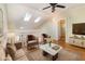 Comfortable living room with vaulted ceiling, skylights and hardwood floor at 1709 Winter Green Blvd, Winter Park, FL 32792