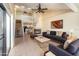 Inviting living room with tile floors, a fireplace, and stairs leading to a loft area at 1709 Winter Green Blvd, Winter Park, FL 32792