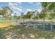 Outdoor tennis court surrounded by chain link fence offering recreational opportunities for residents at 1709 Winter Green Blvd, Winter Park, FL 32792