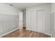 Bedroom featuring neutral paint, wood-look flooring, and a closet at 1811 Oakgrove Ave, Deltona, FL 32725