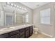 Bathroom featuring a dual sink vanity and a shower at 2005 E Grant Ave, Orlando, FL 32806