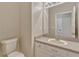 Clean bathroom with single sink vanity, a neutral color scheme, and bright lighting at 2005 E Grant Ave, Orlando, FL 32806