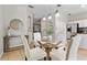 A cozy dining area with stylish pendant lighting and a round glass table at 2005 E Grant Ave, Orlando, FL 32806