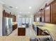 Bright kitchen featuring granite countertops, stainless steel appliances, an island, and a breakfast nook at 228 Bayou Bend Rd, Groveland, FL 34736