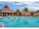 Resort-style pool with palm trees and a clubhouse, offering luxury amenities at 228 Bayou Bend Rd, Groveland, FL 34736