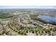 Wide aerial view of a residential community with lakes and lush landscaping at 2319 Grantham Ave, Davenport, FL 33837