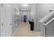 Entrance hallway with tile floor, light gray walls, and decorative artwork, adding a touch of elegance at 2319 Grantham Ave, Davenport, FL 33837