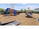 Community playground with slides and various climbing structures on a mulch surface at 2319 Grantham Ave, Davenport, FL 33837