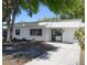 Charming single-story home featuring a clean white facade, well-manicured landscaping, and a welcoming entrance at 2429 Yale Ave, Sanford, FL 32771