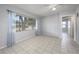 Inviting living room with tile floors and plenty of natural light from a large window at 2429 Yale Ave, Sanford, FL 32771