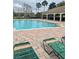 Community swimming pool with lounge chairs and covered seating provides a resort-style experience at 2867 Oconnell Dr, Kissimmee, FL 34741