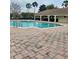 Large community pool with ample seating, perfect for leisure and social gatherings in a beautiful setting at 2867 Oconnell Dr, Kissimmee, FL 34741