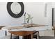 Dining room features a round table with decorative centerpiece and modern pendant light at 2867 Oconnell Dr, Kissimmee, FL 34741