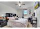 Cozy bedroom featuring a ceiling fan, bright window, and a full sized bed at 2906 Clarabelle Ct, Kissimmee, FL 34743