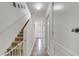 Bright hallway with tile flooring, staircase and access to rooms at 2906 Clarabelle Ct, Kissimmee, FL 34743