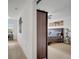 Hallway leading to a bedroom with furniture and carpet flooring at 2906 Clarabelle Ct, Kissimmee, FL 34743