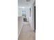 Bright hallway with neutral carpet, leading to other rooms at 2906 Clarabelle Ct, Kissimmee, FL 34743