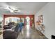 Open living room showcasing tile flooring, an archway, and a ceiling fan at 2906 Clarabelle Ct, Kissimmee, FL 34743