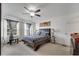 Spacious main bedroom featuring carpet flooring, a ceiling fan, and sheer curtains at 2906 Clarabelle Ct, Kissimmee, FL 34743