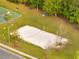 Volleyball court in a community park, with a net, surrounded by trees and grass at 2906 Clarabelle Ct, Kissimmee, FL 34743