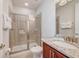 Bathroom with a glass-enclosed shower and granite countertops at 310 Pendant Ct, Kissimmee, FL 34747