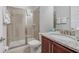 This bathroom features a glass shower, granite countertop, and modern fixtures at 310 Pendant Ct, Kissimmee, FL 34747