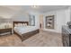 Bedroom with a large bed, dresser and art mirror at 310 Pendant Ct, Kissimmee, FL 34747