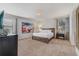 Bright bedroom with a large bed, dresser, and colorful art at 310 Pendant Ct, Kissimmee, FL 34747