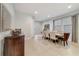 Bright dining area features a large table, six chairs, and tile flooring at 310 Pendant Ct, Kissimmee, FL 34747