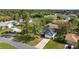 An aerial view shows a single-Gathering home with a long driveway and well-kept landscaping at 3209 Hanley St, Deltona, FL 32738