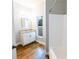 Bathroom featuring a vanity with granite countertop, a large mirror, and a shower-tub combination at 3209 Hanley St, Deltona, FL 32738