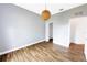 A bright bedroom with wood floors, neutral walls and a unique sphere pendant light fixture at 3209 Hanley St, Deltona, FL 32738