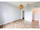 A bright bedroom features modern wood flooring and neutral walls at 3209 Hanley St, Deltona, FL 32738