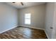 This cozy bedroom features modern wood flooring and a bright window at 3209 Hanley St, Deltona, FL 32738