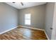 Simple bedroom with a window and neutral wall paint at 3209 Hanley St, Deltona, FL 32738