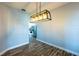 Bright dining room featuring modern light fixture and stylish flooring at 3209 Hanley St, Deltona, FL 32738