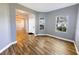 Inviting entryway with natural light and stylish wood-look flooring at 3209 Hanley St, Deltona, FL 32738