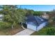 This angle shows the home's painted exterior, solar panels, attached garage, and well-kept lawn at 3209 Hanley St, Deltona, FL 32738