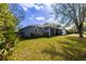 Charming home with well-manicured lawn, mature trees, and inviting entrance at 3209 Hanley St, Deltona, FL 32738