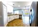 Kitchen featuring granite counters, stainless steel appliances, and modern white cabinets at 3209 Hanley St, Deltona, FL 32738