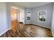 Spacious living room with wood-look flooring and plenty of natural light at 3209 Hanley St, Deltona, FL 32738