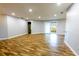 Bright living room featuring wood floors, recessed lighting, and sliding glass doors at 3209 Hanley St, Deltona, FL 32738