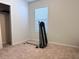 Empty bedroom featuring a carpeted floor, a window with blinds and a closet with wire shelving at 398 Citrus Isle Loop, Davenport, FL 33837