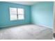 Light and airy bedroom with large window and neutral carpet at 398 Citrus Isle Loop, Davenport, FL 33837