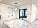 Dining area features tile flooring, modern pendant lighting and sliding doors to outdoor patio at 398 Citrus Isle Loop, Davenport, FL 33837