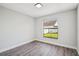 This is a bright bedroom with new paint and modern gray laminate flooring at 413 Mainsail Ct, Lake Mary, FL 32746